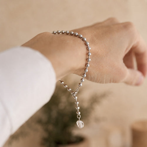 Close-up of the ANCHOR bracelet with quartz crystal charm on the wrist - Rocking Vibe