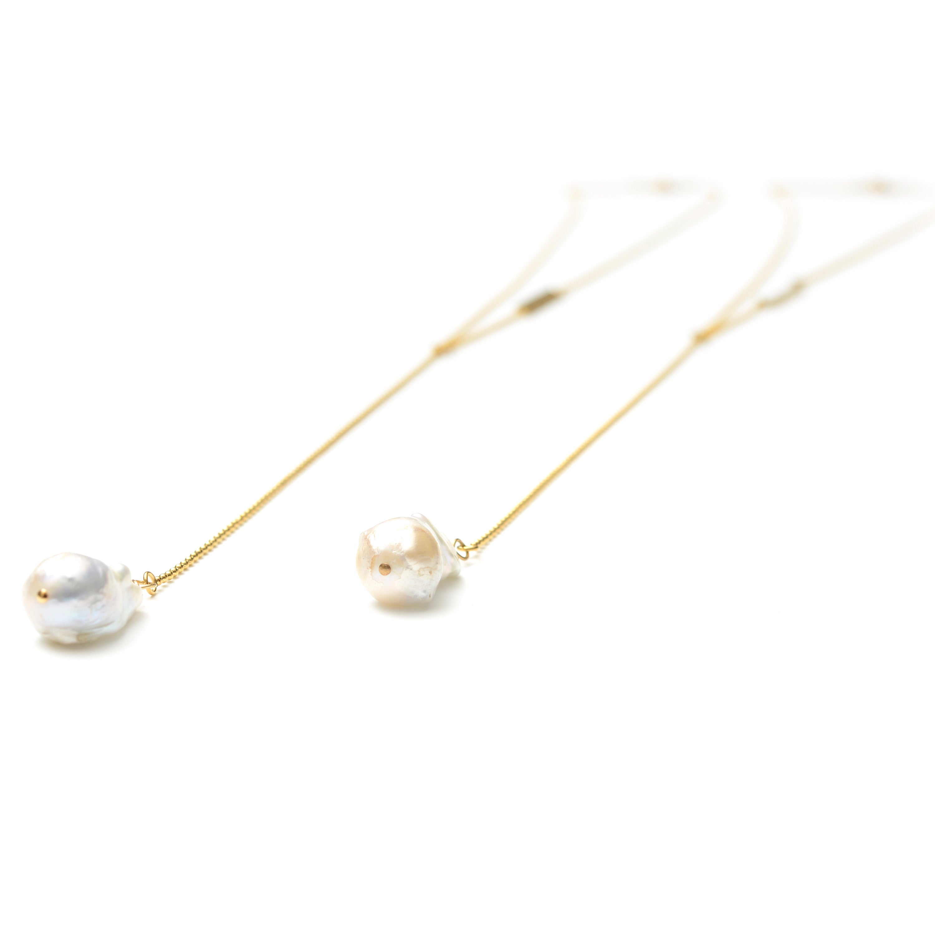 Nurture long diffuser necklace in gold, flat lay - Rocking Vibe