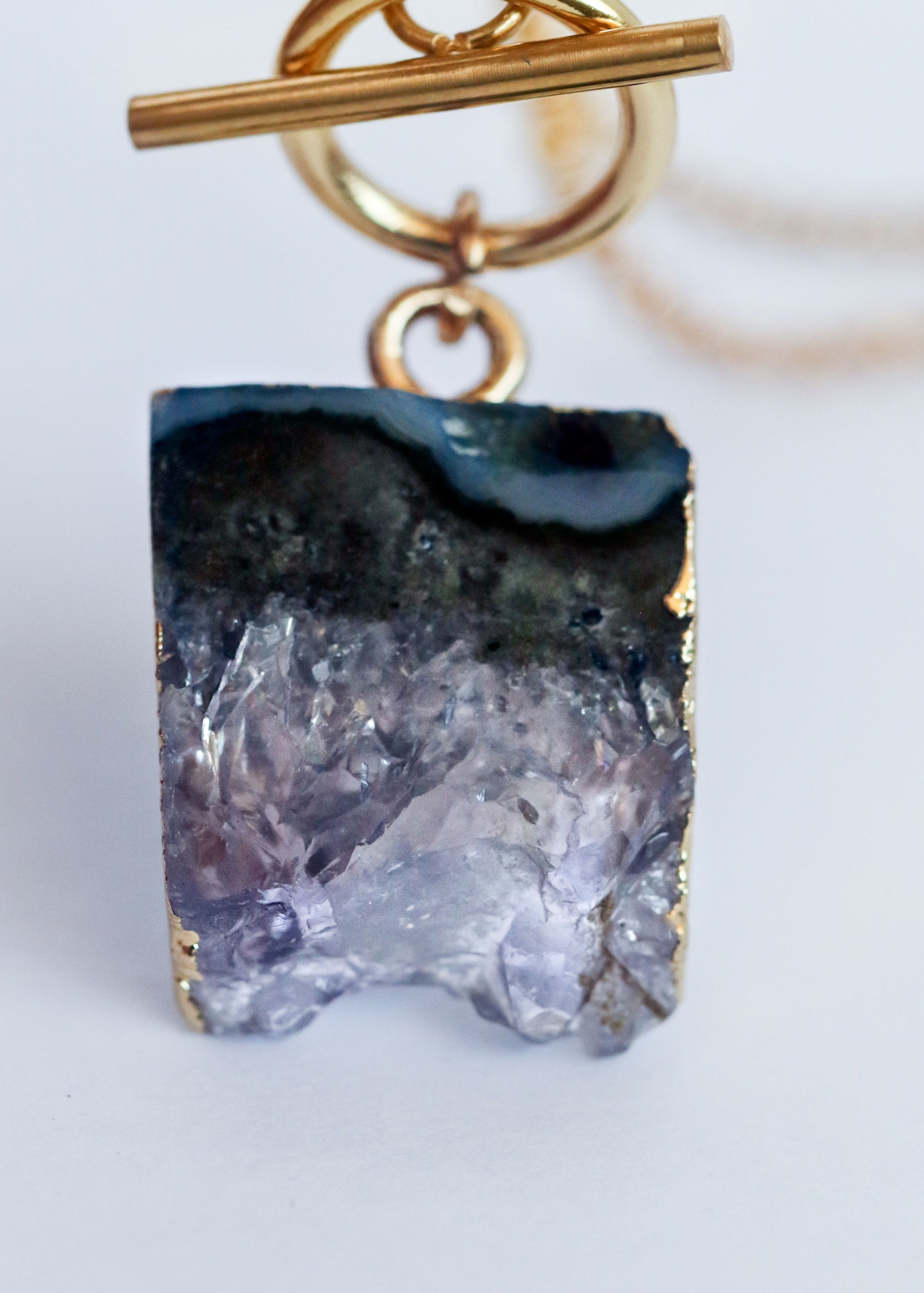 Origin necklace in gold with amethyst, alternate view - Rocking Vibe
