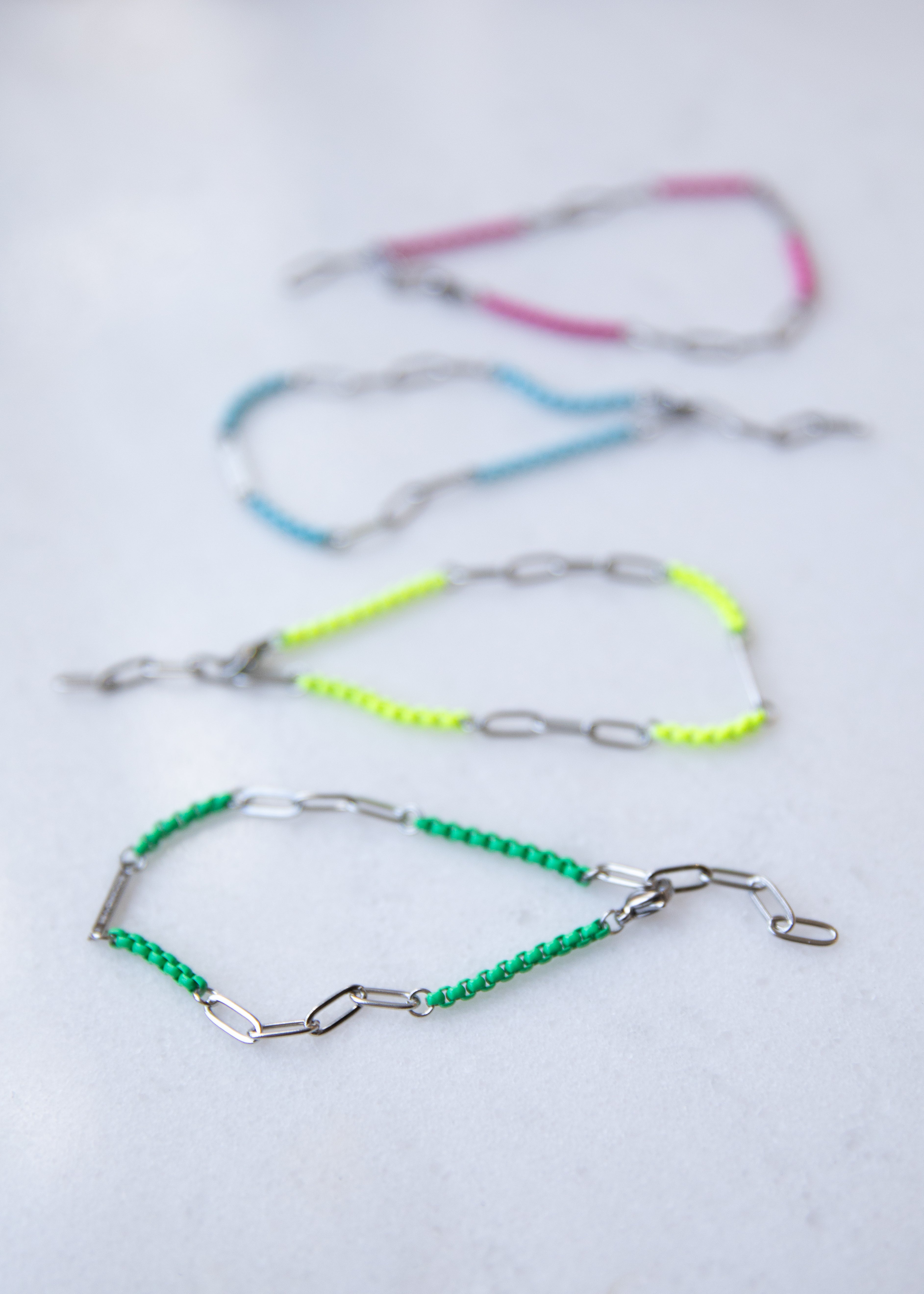 Set of colorful beaded chains on a white background