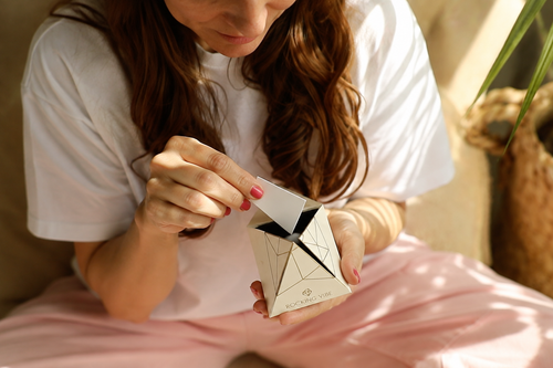 Opening the Rocking Vibe Intention Pyramid to place a written note inside