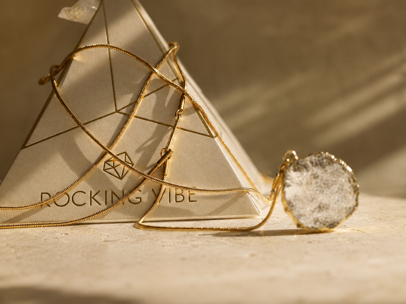 Close-up of gold chain links and baroque pearls on a Rocking Vibe piece, representing intentional design