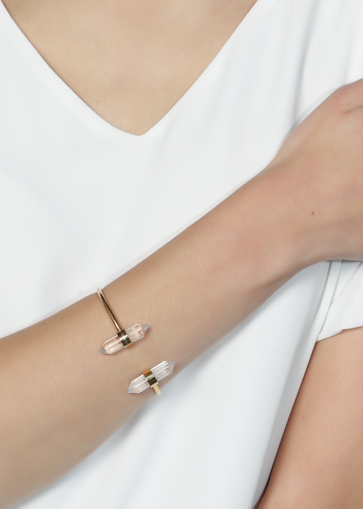 Adjustable clear quartz crystal bangle with dual faceted spears and sculptural steel band, minimalist modern jewelry by Rocking Vibe