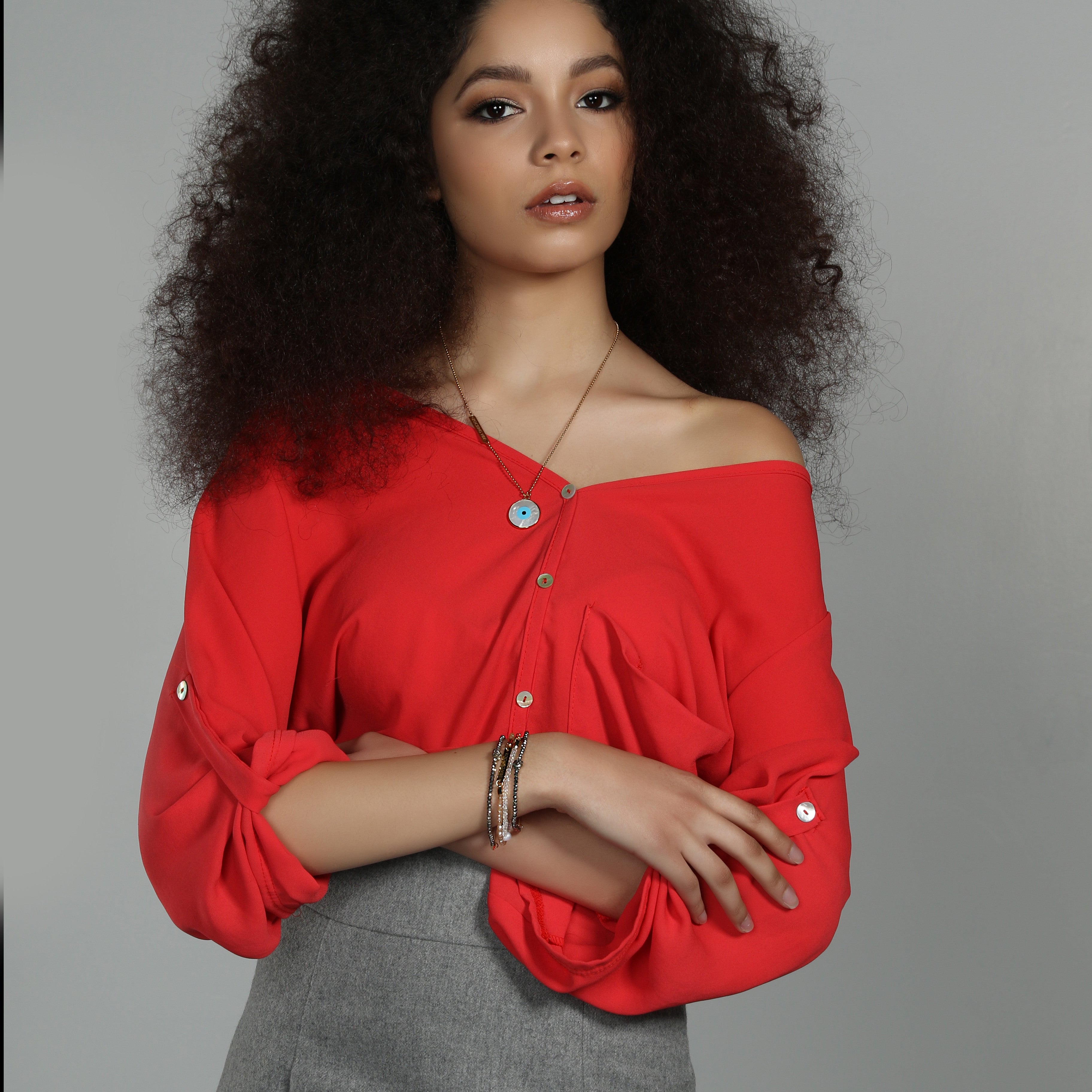 Journey diffuser necklace in gold, office lifestyle shot - Rocking Vibe